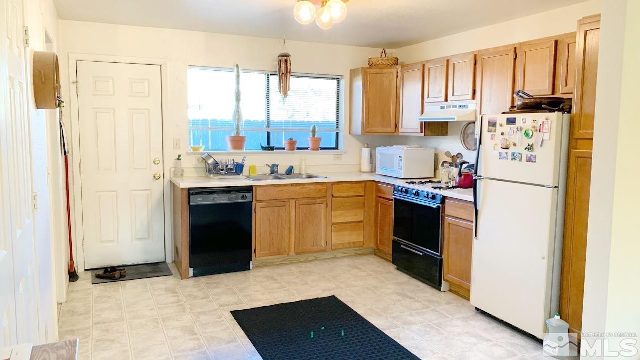 1021 Haskell Street Reno, NV 89509 - Photo 3 of 18 a kitchen with a sink stove and refrigerator