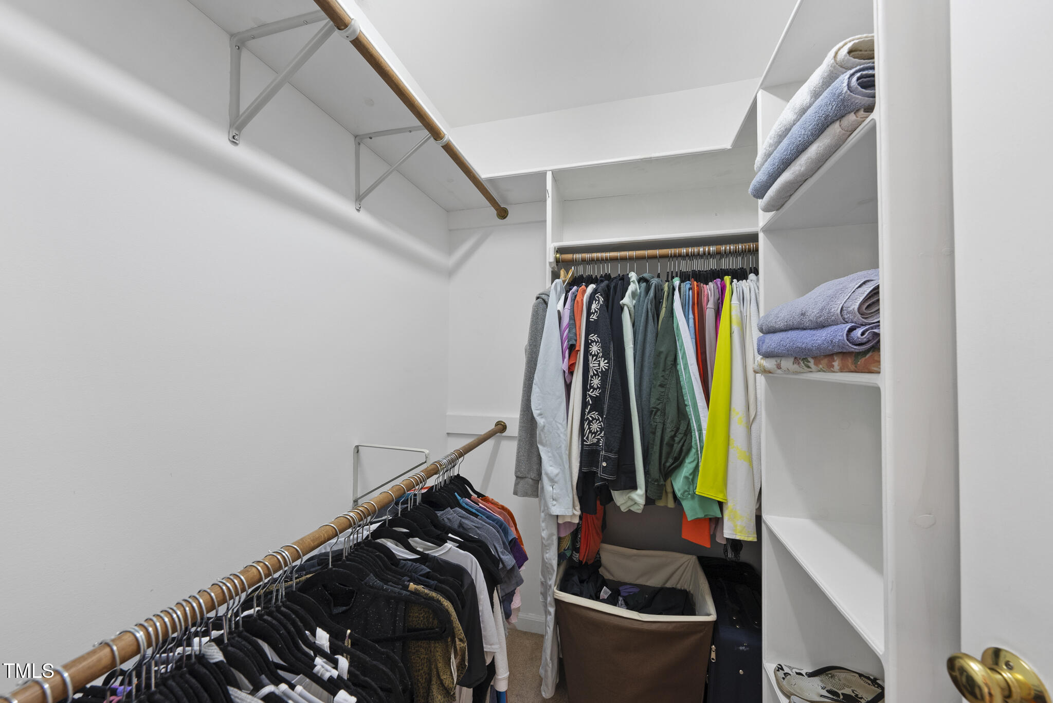 1609 Forest Road Wake Forest, NC 27587 - Photo 11 of 22 a view of walk in closet with clothes and shoes