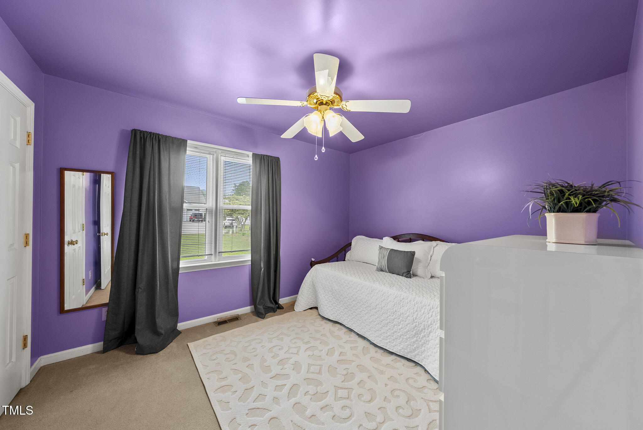 1609 Forest Road Wake Forest, NC 27587 - Photo 14 of 22 a bedroom with a bed chandelier and a window