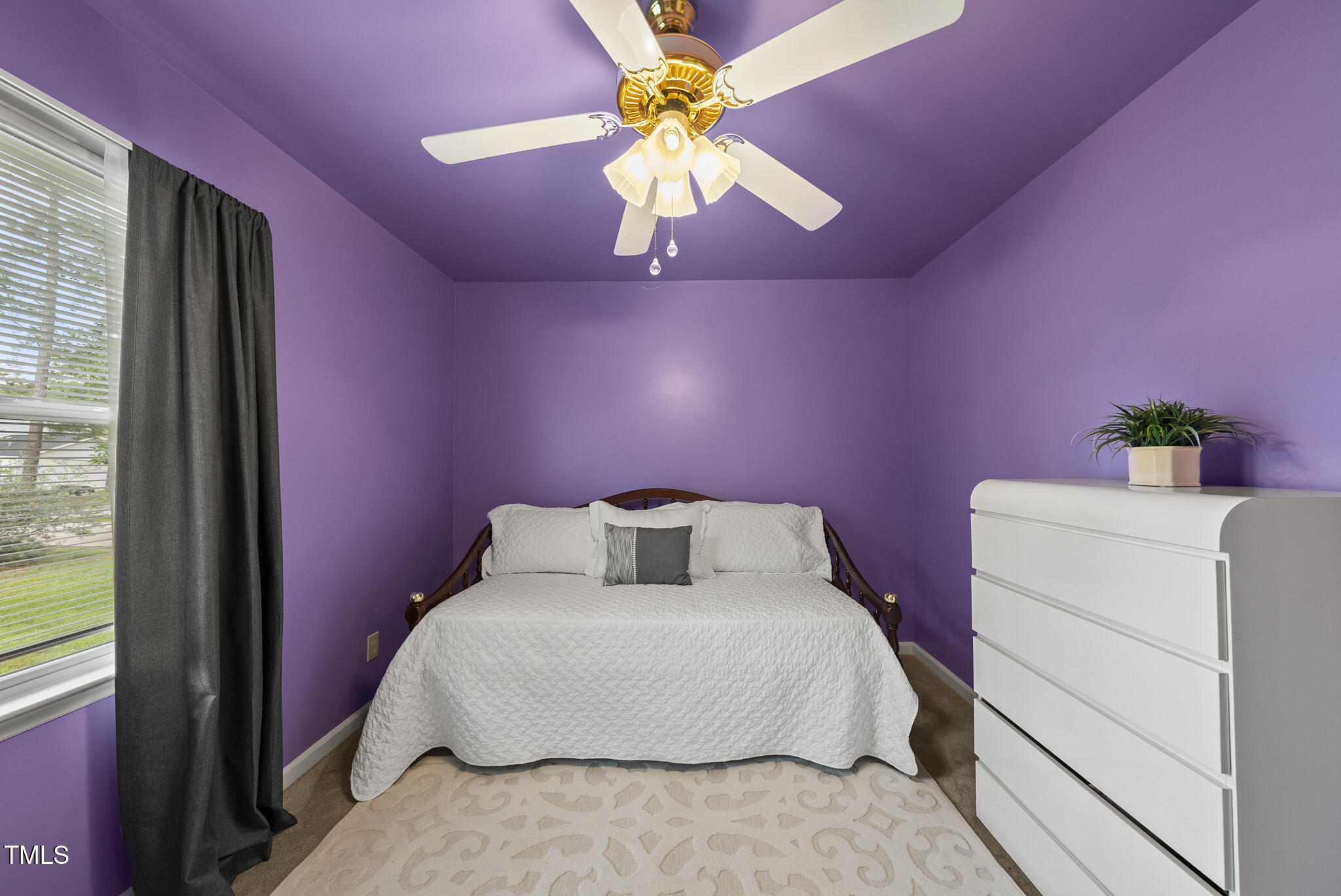 1609 Forest Road Wake Forest, NC 27587 - Photo 15 of 22 a bedroom with a bed and a chandelier
