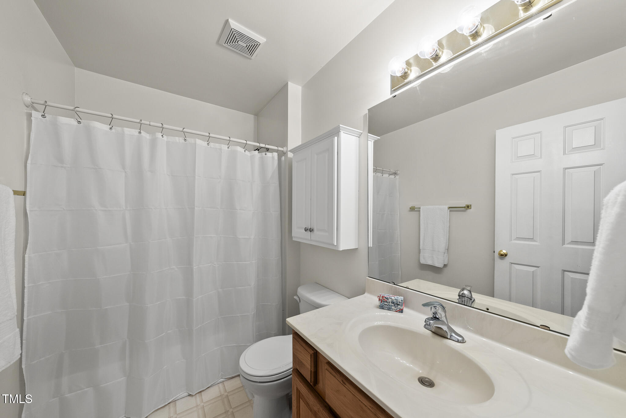1609 Forest Road Wake Forest, NC 27587 - Photo 16 of 22 a bathroom with a sink toilet and shower