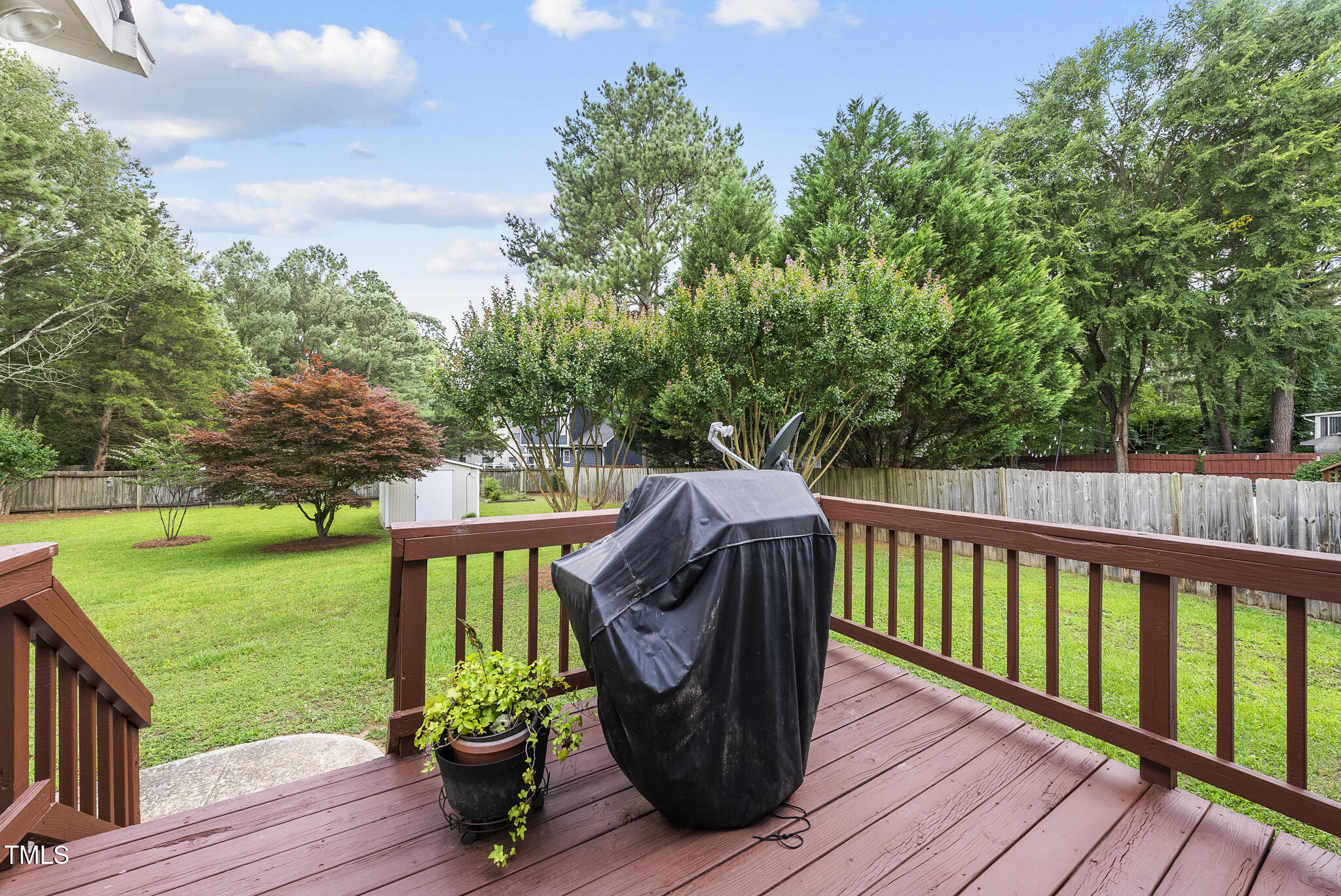 1609 Forest Road Wake Forest, NC 27587 - Photo 18 of 22 a view of a deck with wooden floor and fence