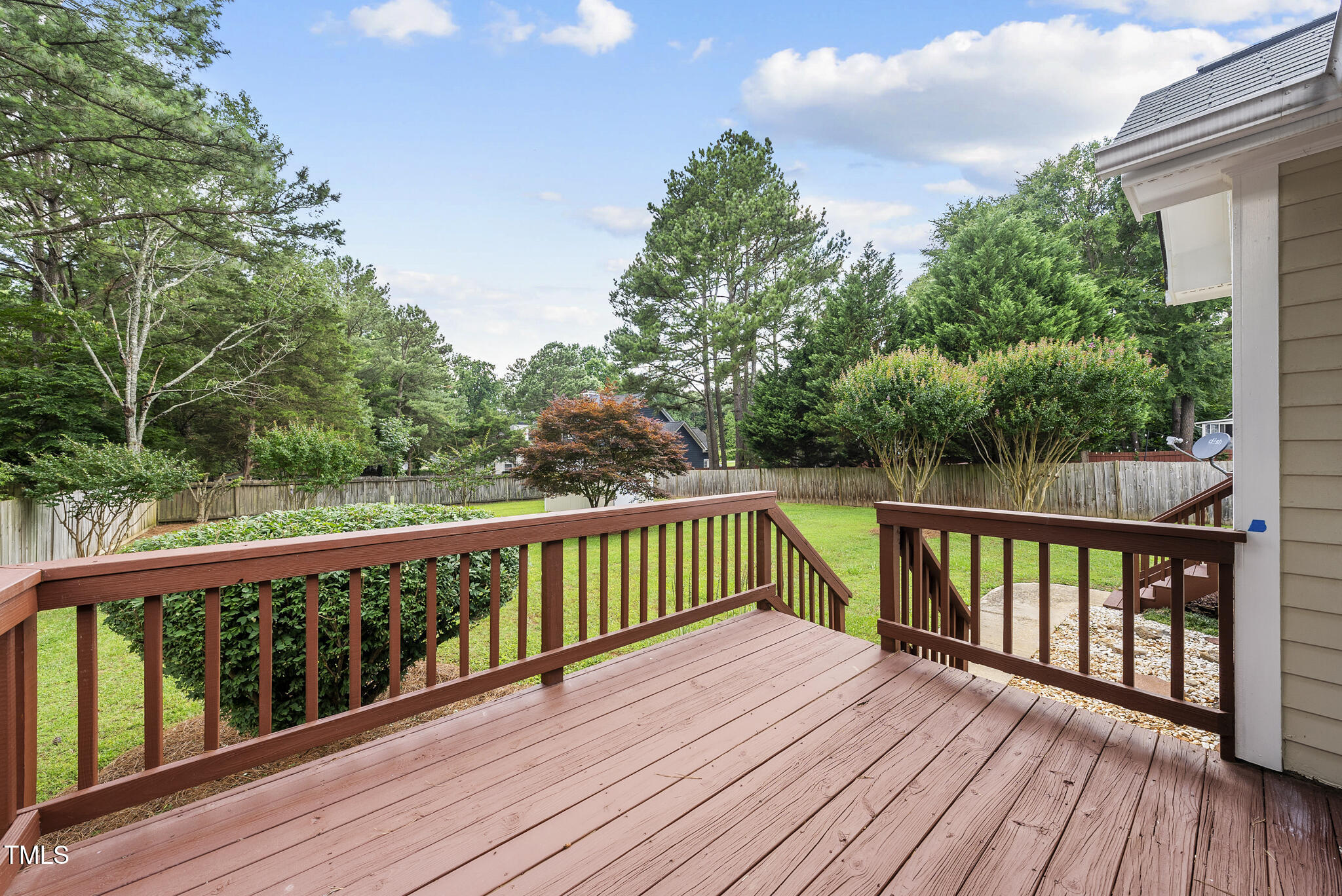 1609 Forest Road Wake Forest, NC 27587 - Photo 19 of 22 a balcony with wooden floor and fence
