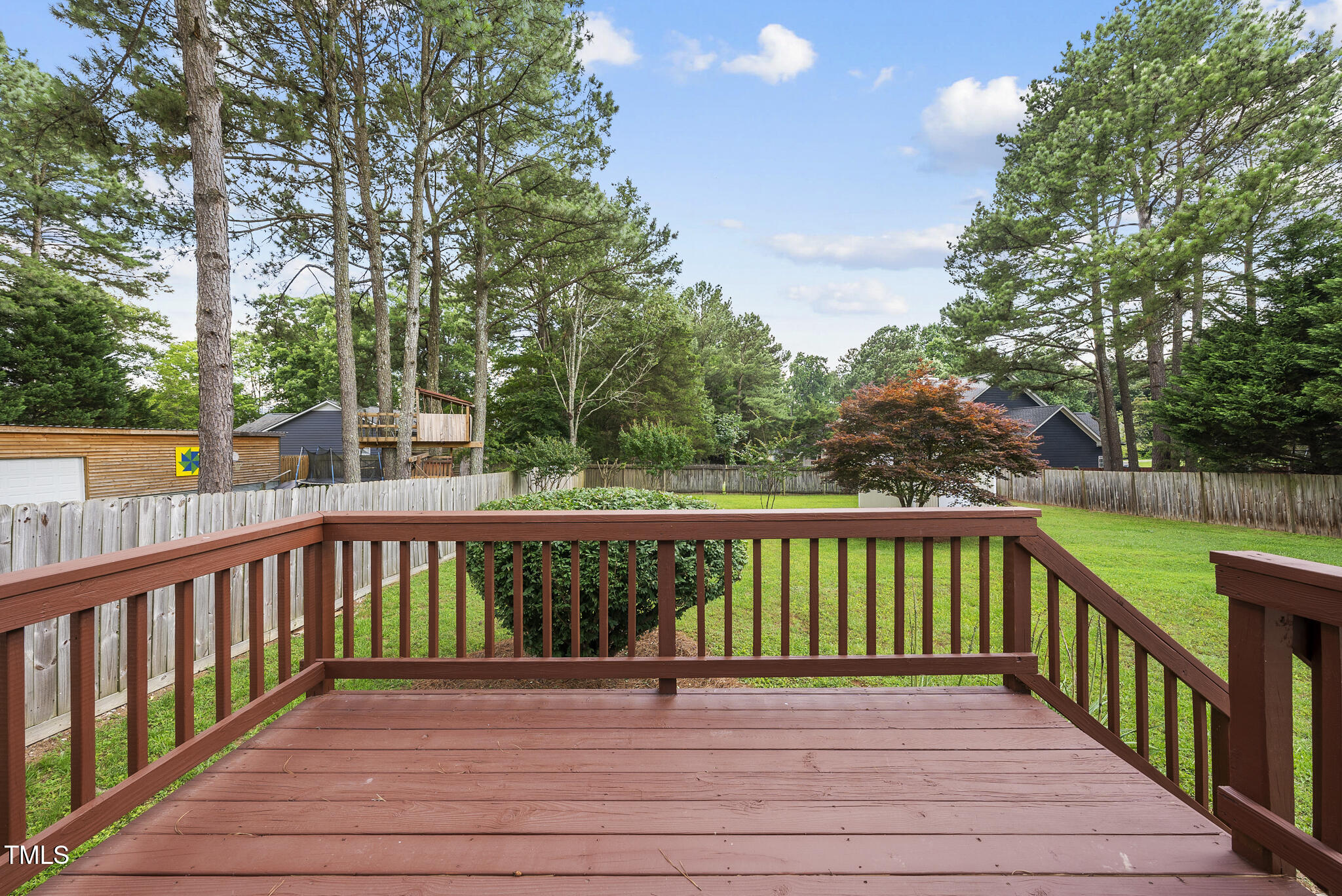 1609 Forest Road Wake Forest, NC 27587 - Photo 20 of 22 a view of a deck with trees in the background