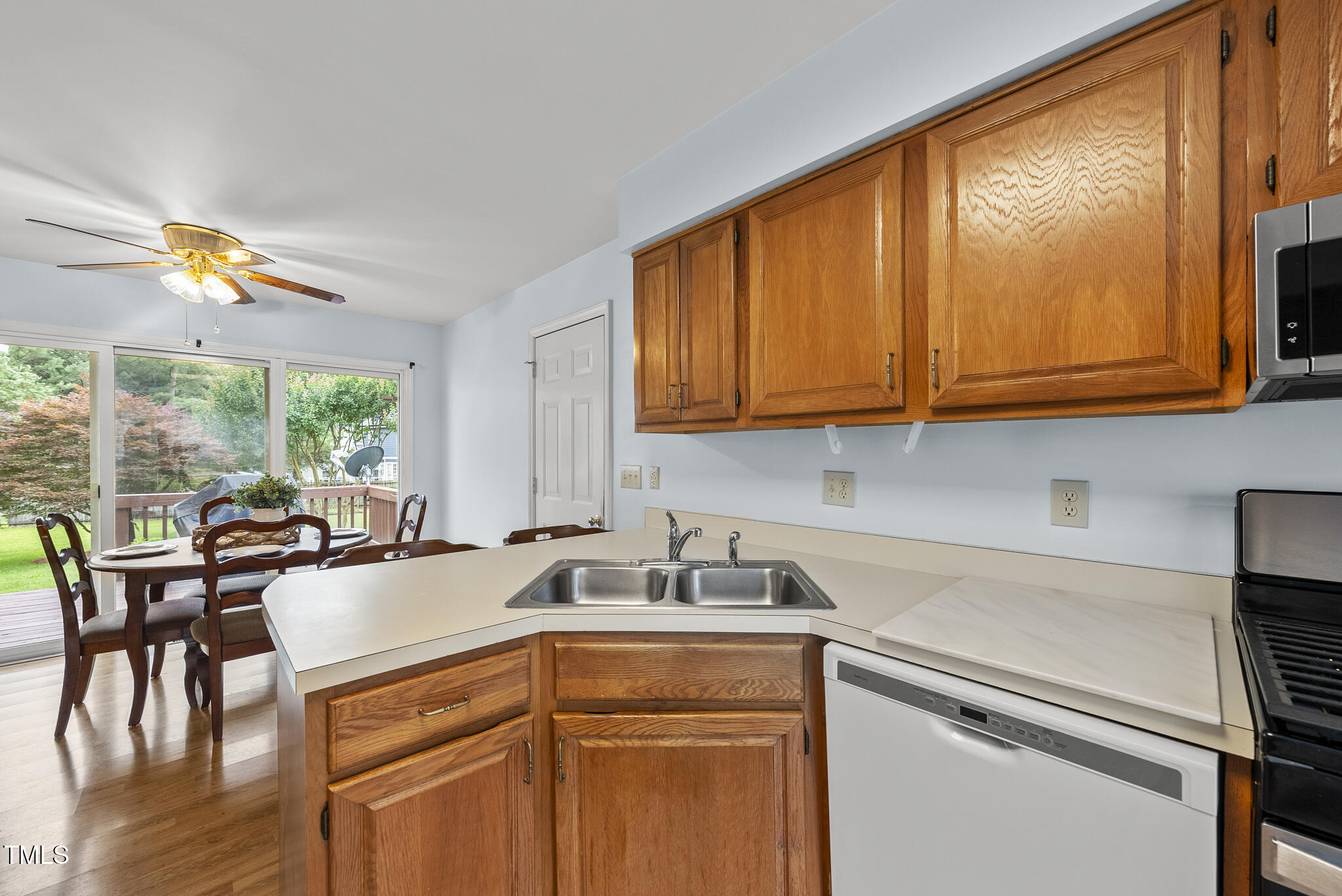 1609 Forest Road Wake Forest, NC 27587 - Photo 4 of 22 a kitchen with a sink a stove and cabinets