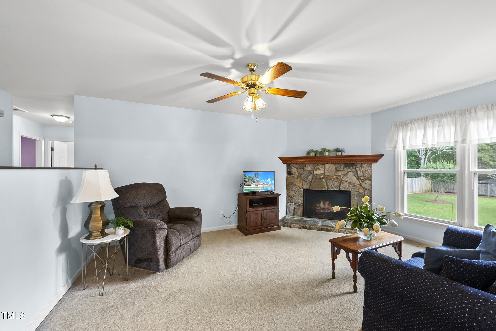 1609 Forest Road Wake Forest, NC 27587 - Photo 7 of 22 a living room with furniture and a fireplace