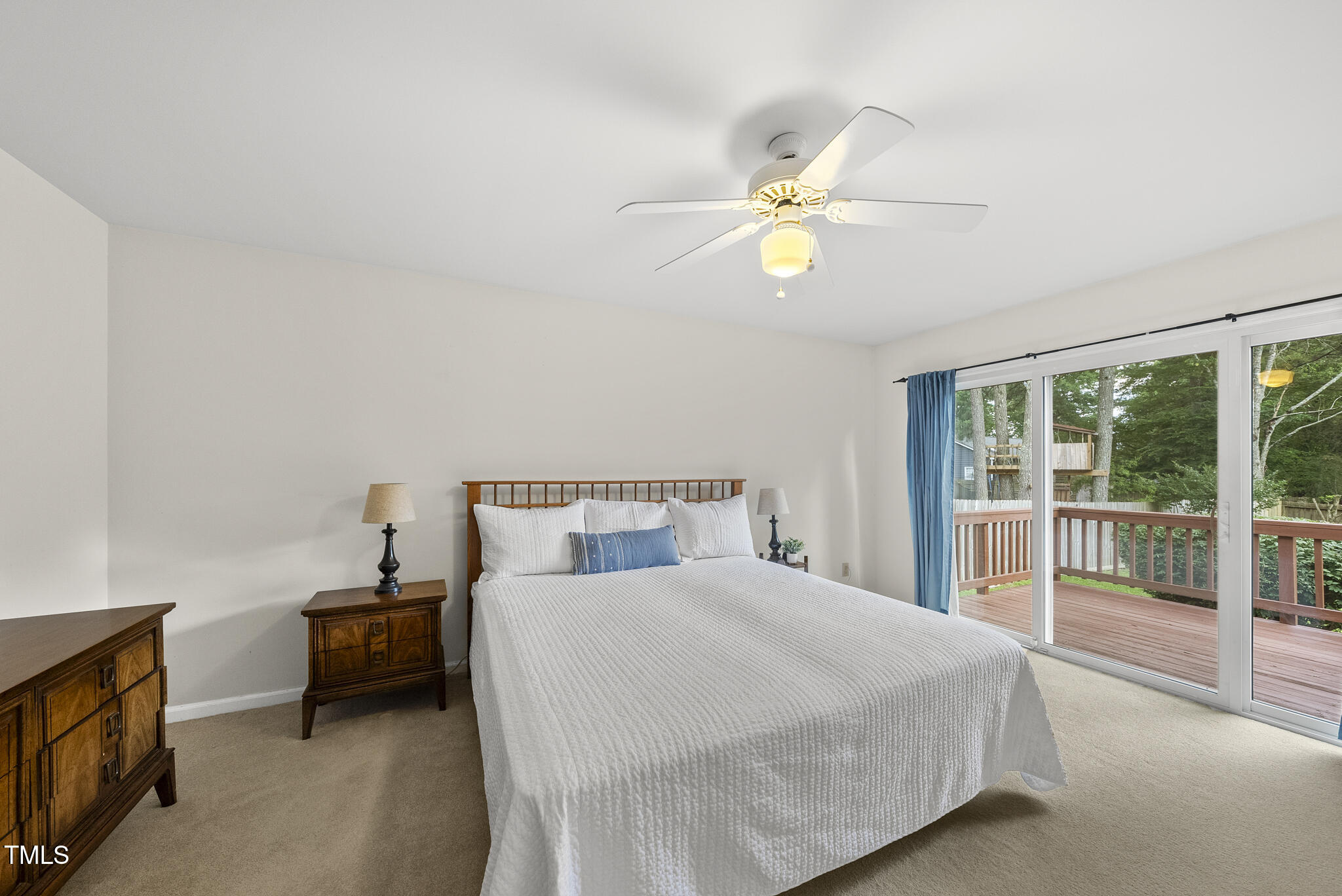 1609 Forest Road Wake Forest, NC 27587 - Photo 10 of 22 a bedroom with a bed and a chandelier