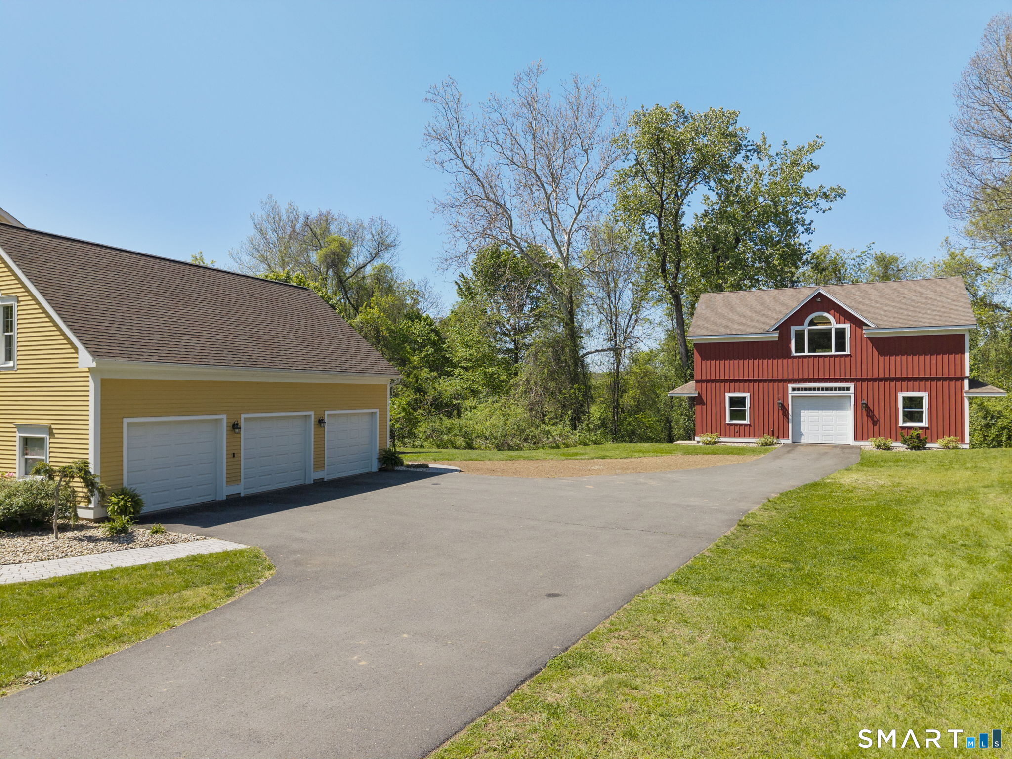 555 Waterville Road Avon, CT 06001 - Photo 8 of 40 a view of a house with a yard