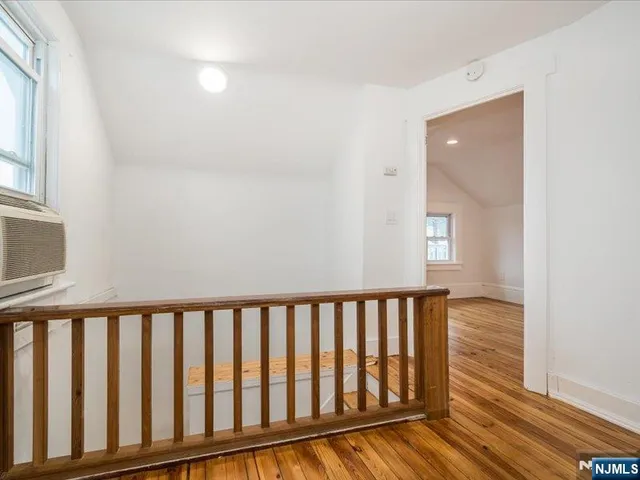 a view of a porch with wooden floor
