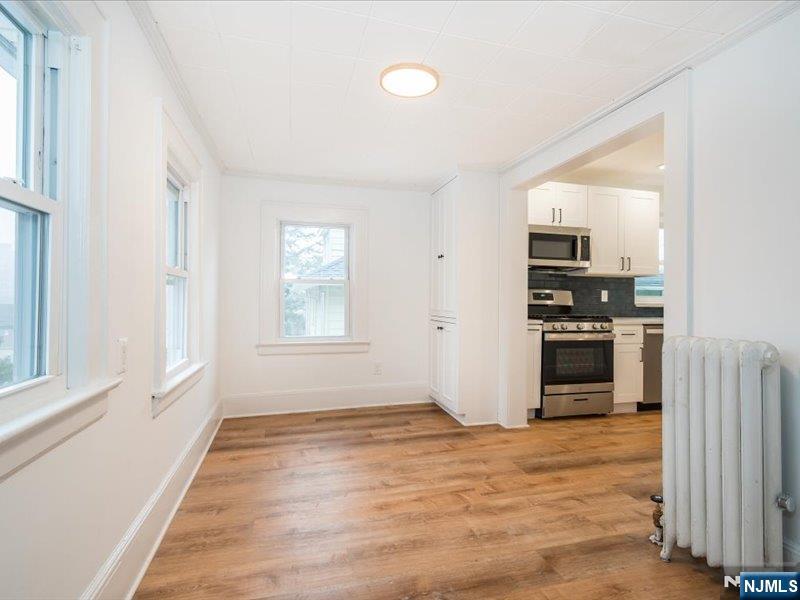 14 Ravine Avenue, Unit 2 Caldwell, NJ 07006 - Photo 10 of 23 a kitchen with a refrigerator and a stove top oven