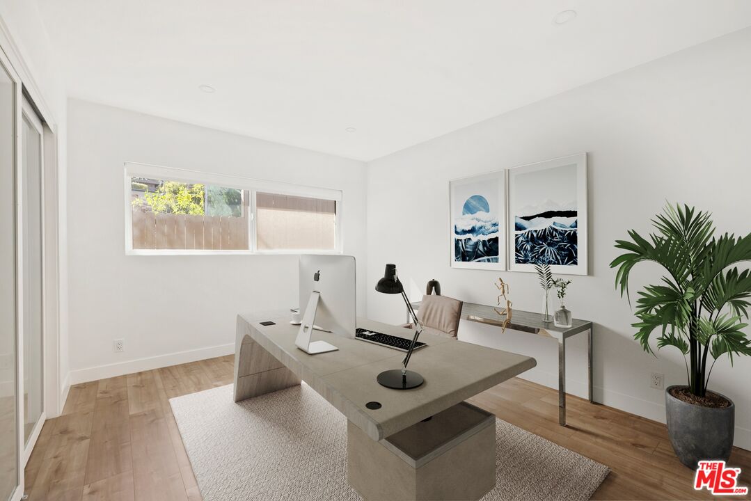 2204 Ridgemont Drive Los Angeles, CA 90046 - Photo 12 of 13 a living room with furniture and potted plant