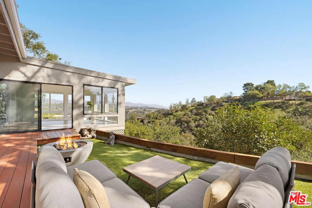2204 Ridgemont Drive Los Angeles, CA 90046 - Photo 2 of 13 a view of a chairs and table in patio