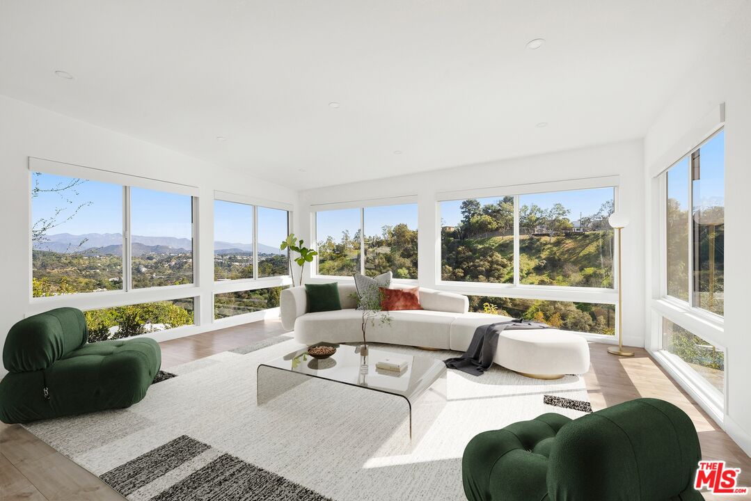 2204 Ridgemont Drive Los Angeles, CA 90046 - Photo 3 of 13 a living room with furniture and a large window