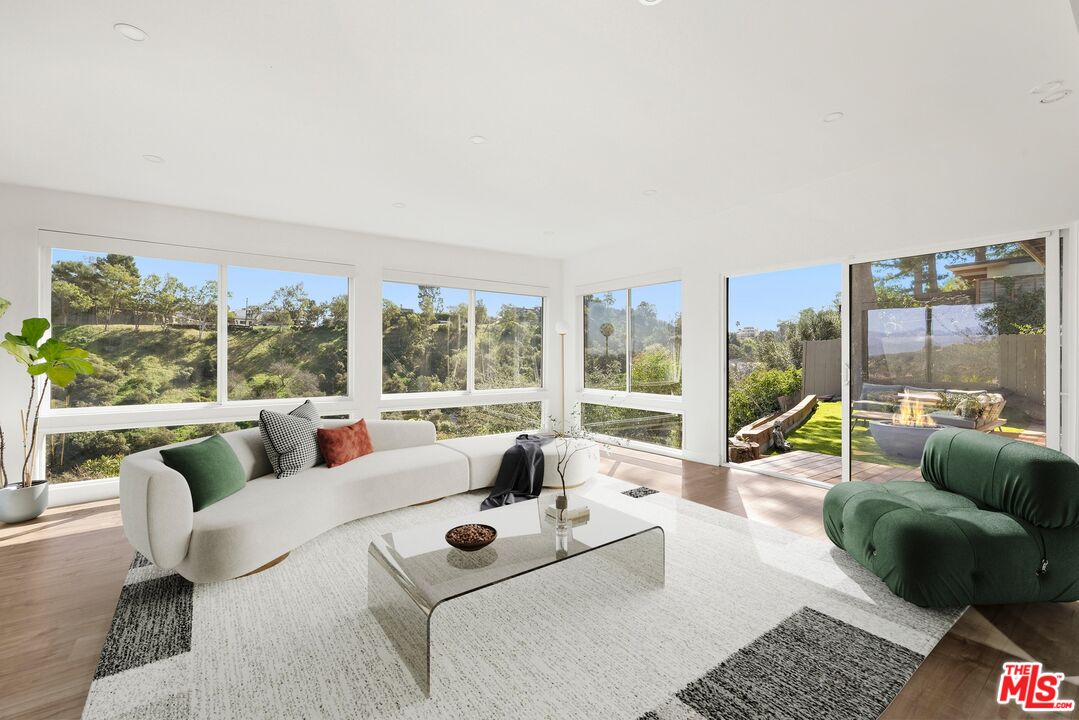 2204 Ridgemont Drive Los Angeles, CA 90046 - Photo 4 of 13 a living room with furniture and a large window