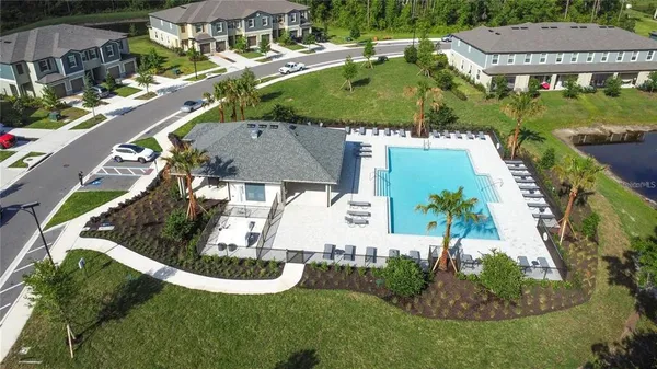 a view of a swimming pool with a yard