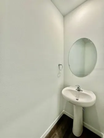a bathroom with a sink and mirror