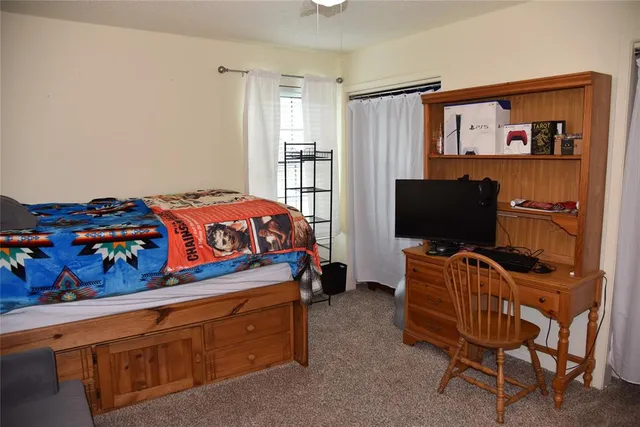 a bedroom with a bed and furniture