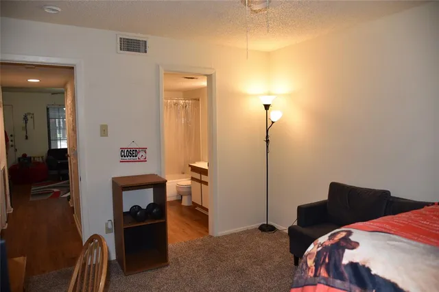 a bedroom with a bed and a closet