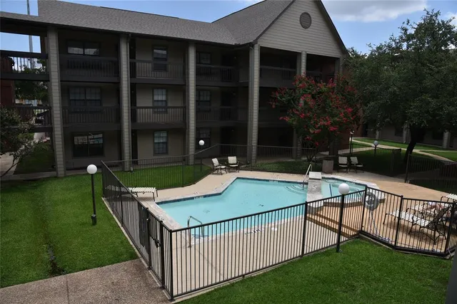 a view of a house with backyard and porch