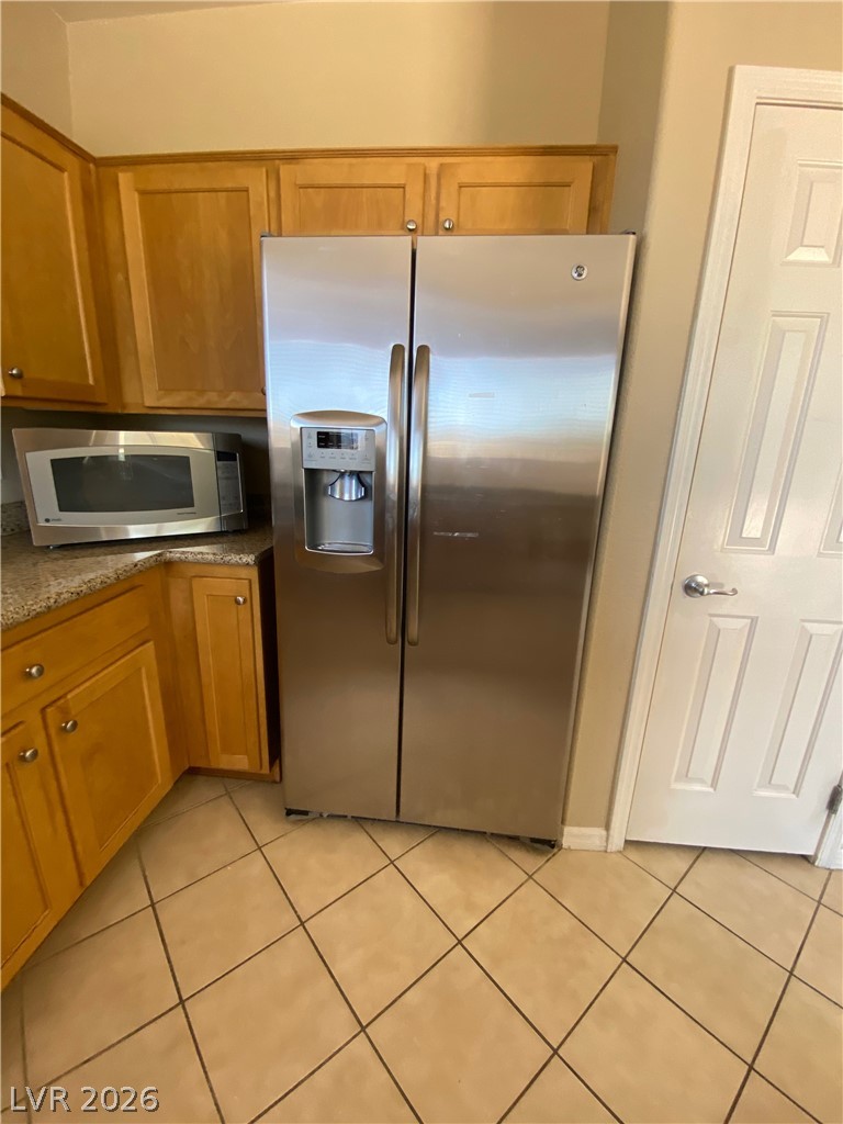 489 Foster Springs Road Las Vegas, NV 89148 - Photo 5 of 30 A well-appointed kitchen corner features stainless steel appliances and ample cabinetry.