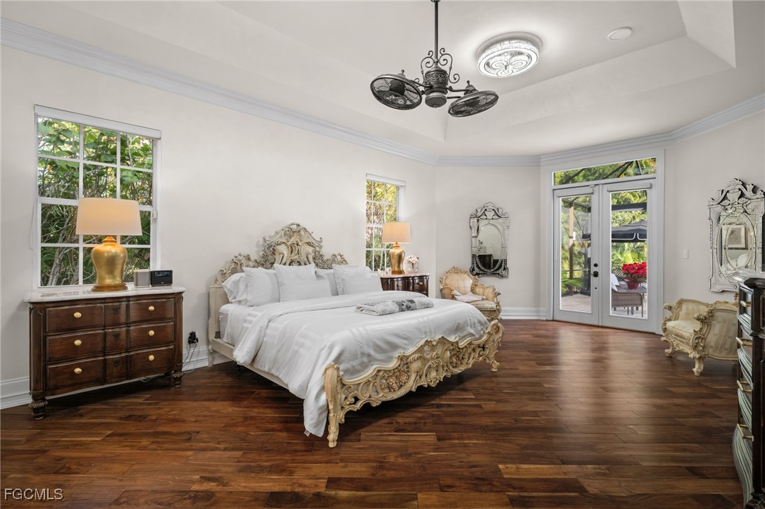 9250 The Lane Naples, FL 34109 - Photo 20 of 50 a bedroom with a bed and window