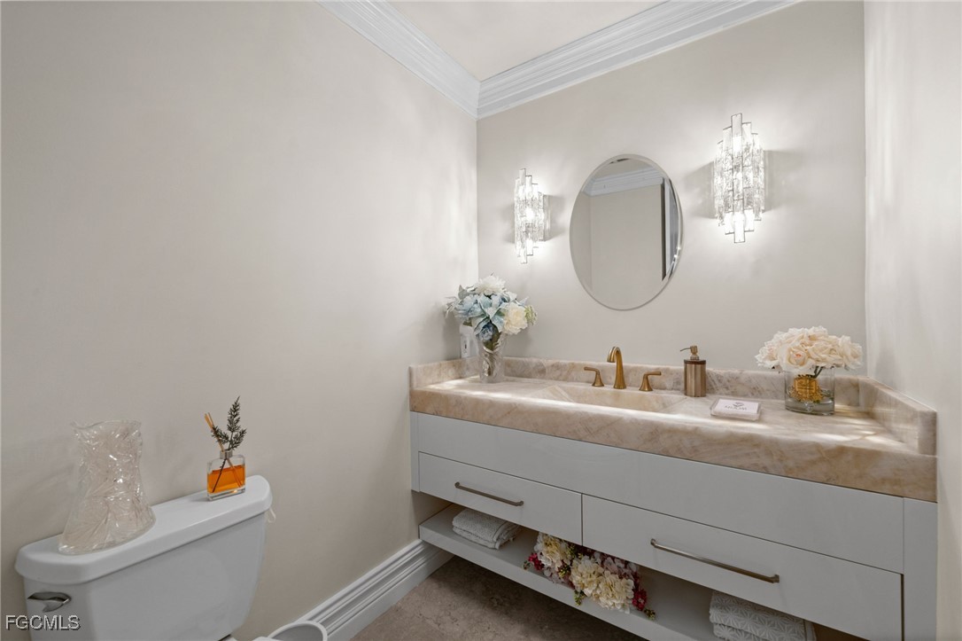9250 The Lane Naples, FL 34109 - Photo 25 of 50 a bathroom with a sink and a mirror