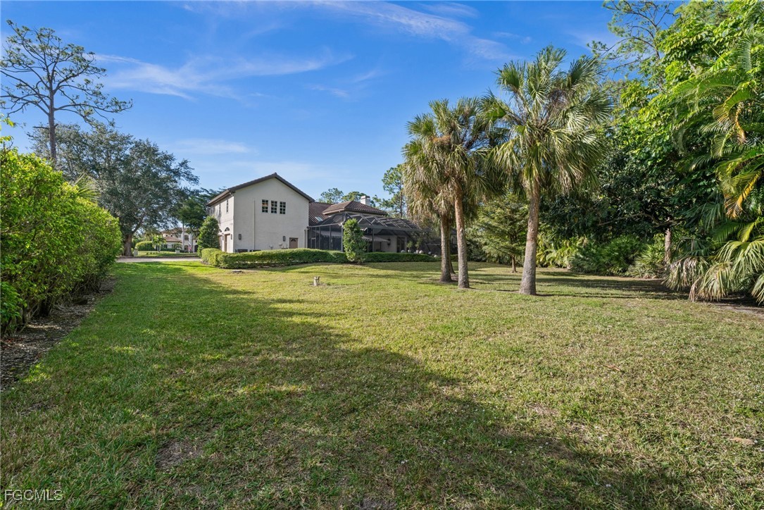 9250 The Lane Naples, FL 34109 - Photo 29 of 50 a view of a house with a yard