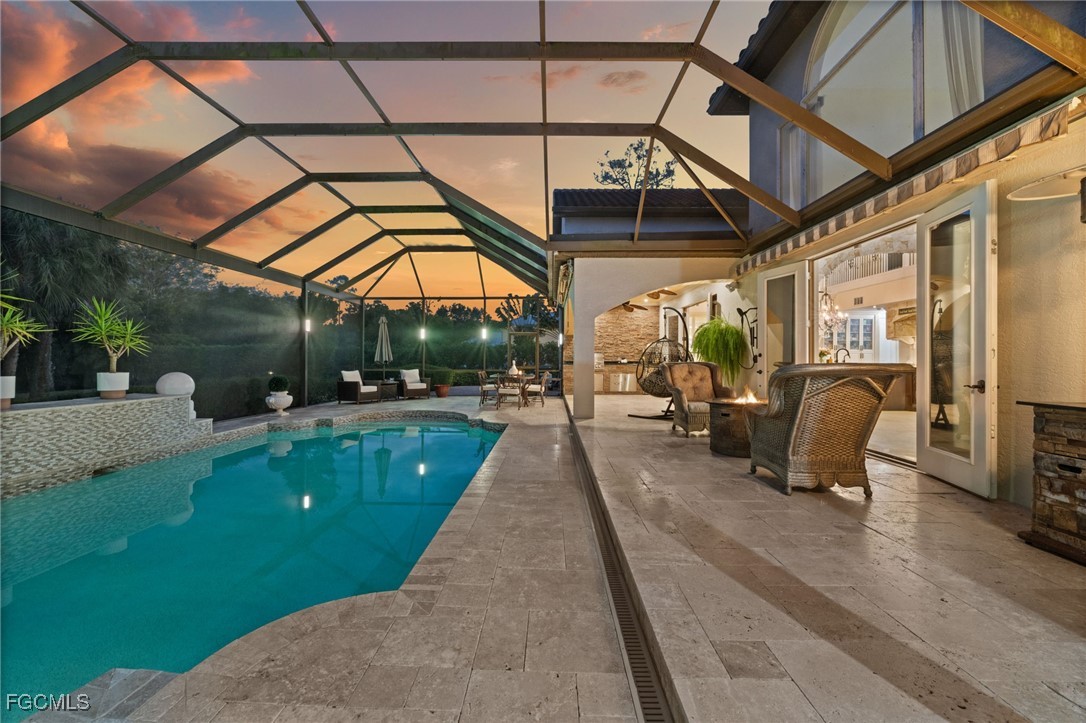 9250 The Lane Naples, FL 34109 - Photo 31 of 50 a view of a porch with furniture and a yard