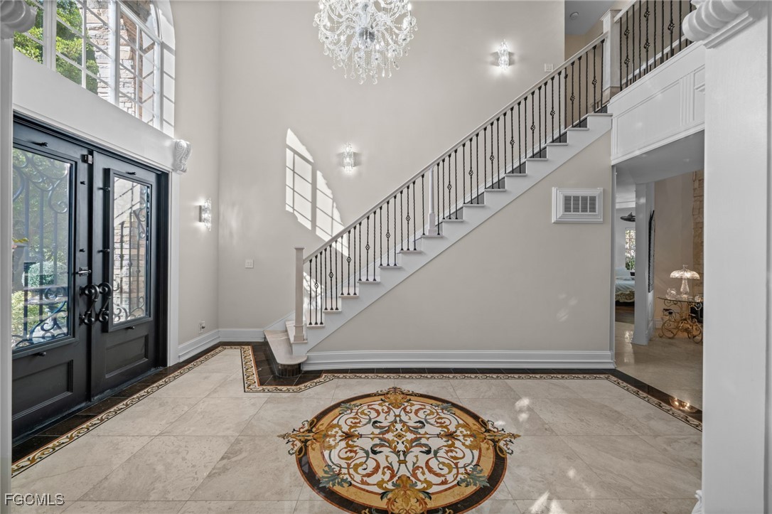 9250 The Lane Naples, FL 34109 - Photo 7 of 50 a view of entryway with a front door