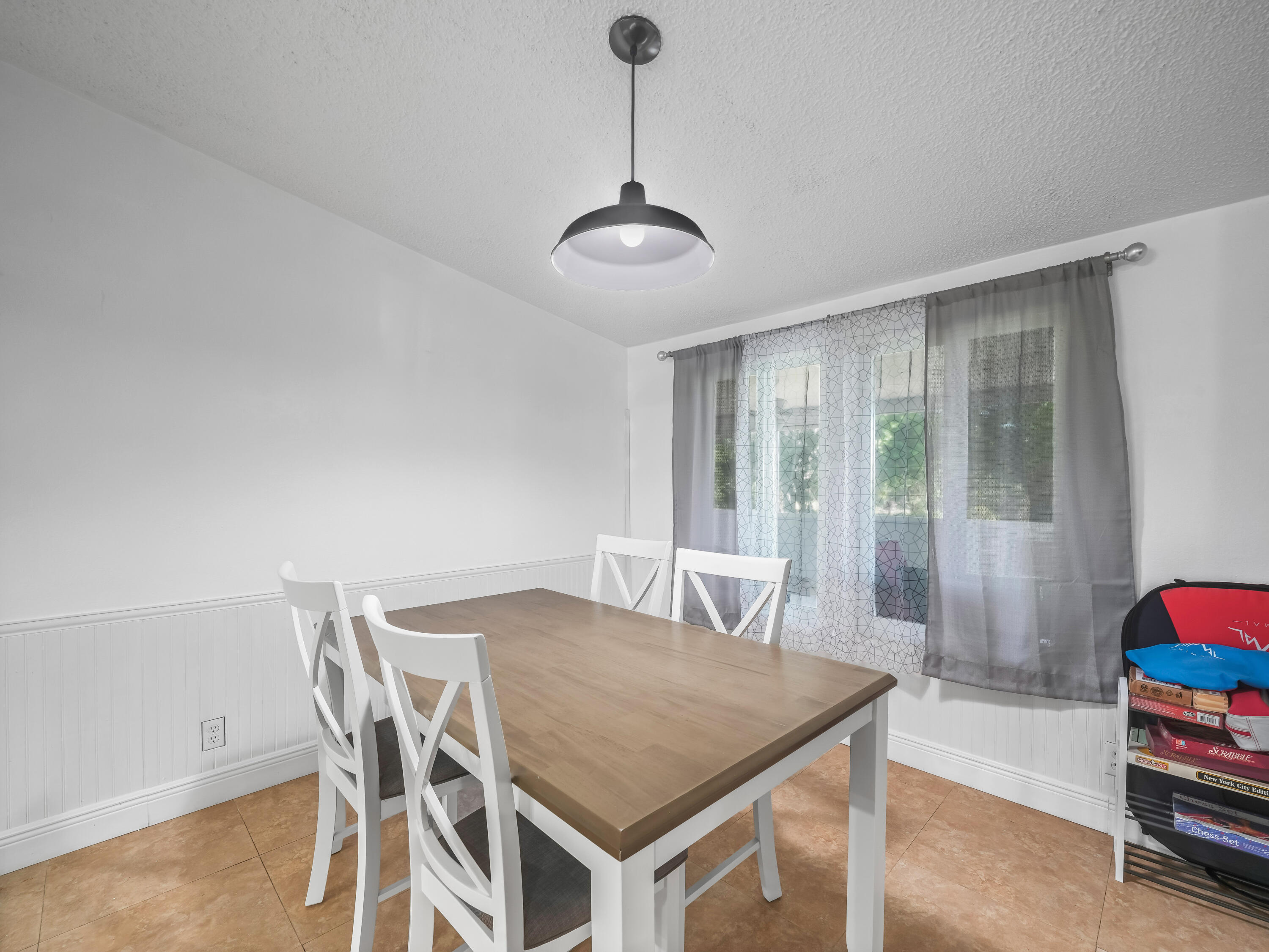 329 Kilpatrick Loop Clewiston, FL 33440 - Photo 11 of 56 a view of a dining room with furniture and wooden floor