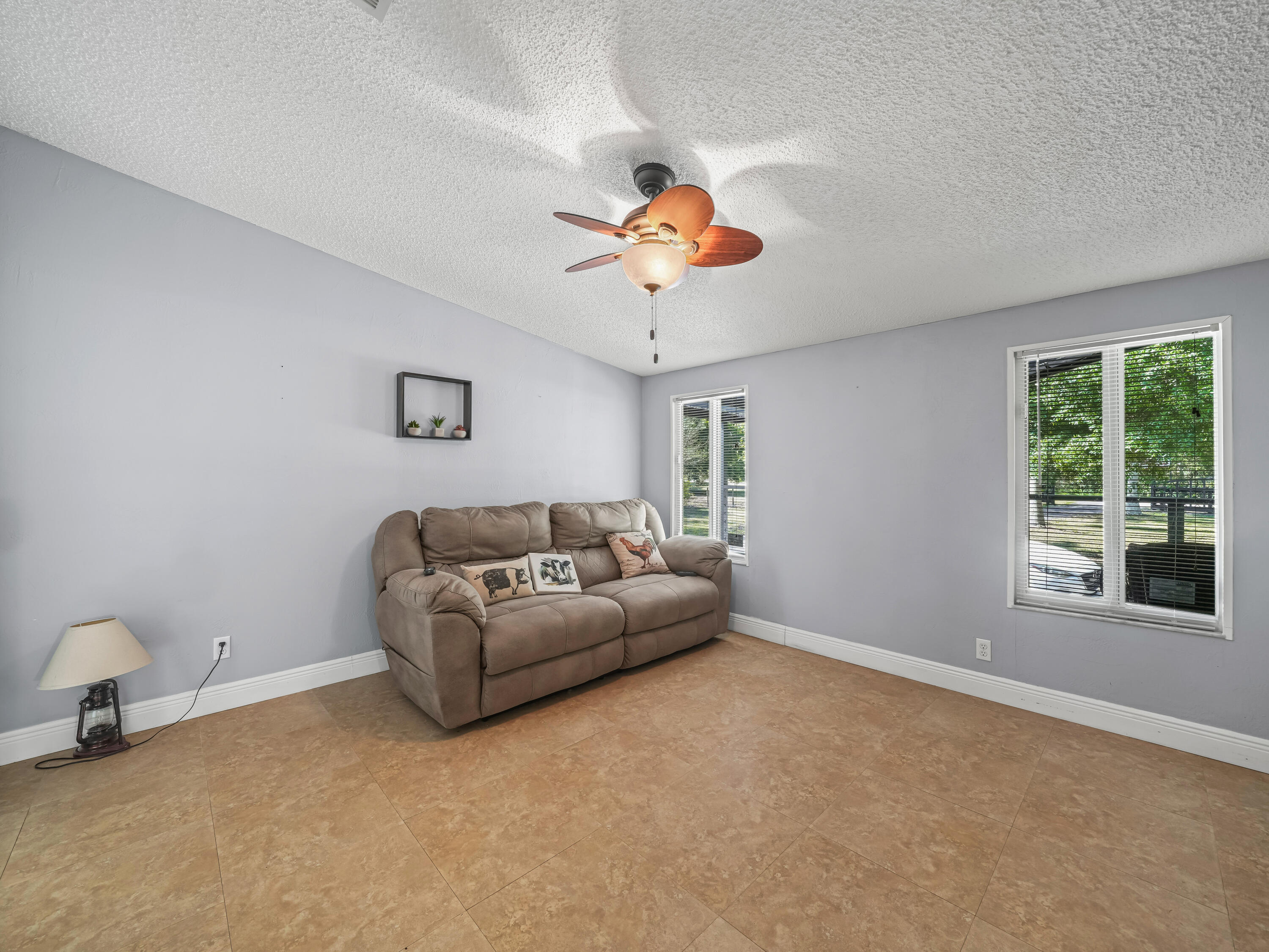 329 Kilpatrick Loop Clewiston, FL 33440 - Photo 13 of 56 a living room with furniture and a window
