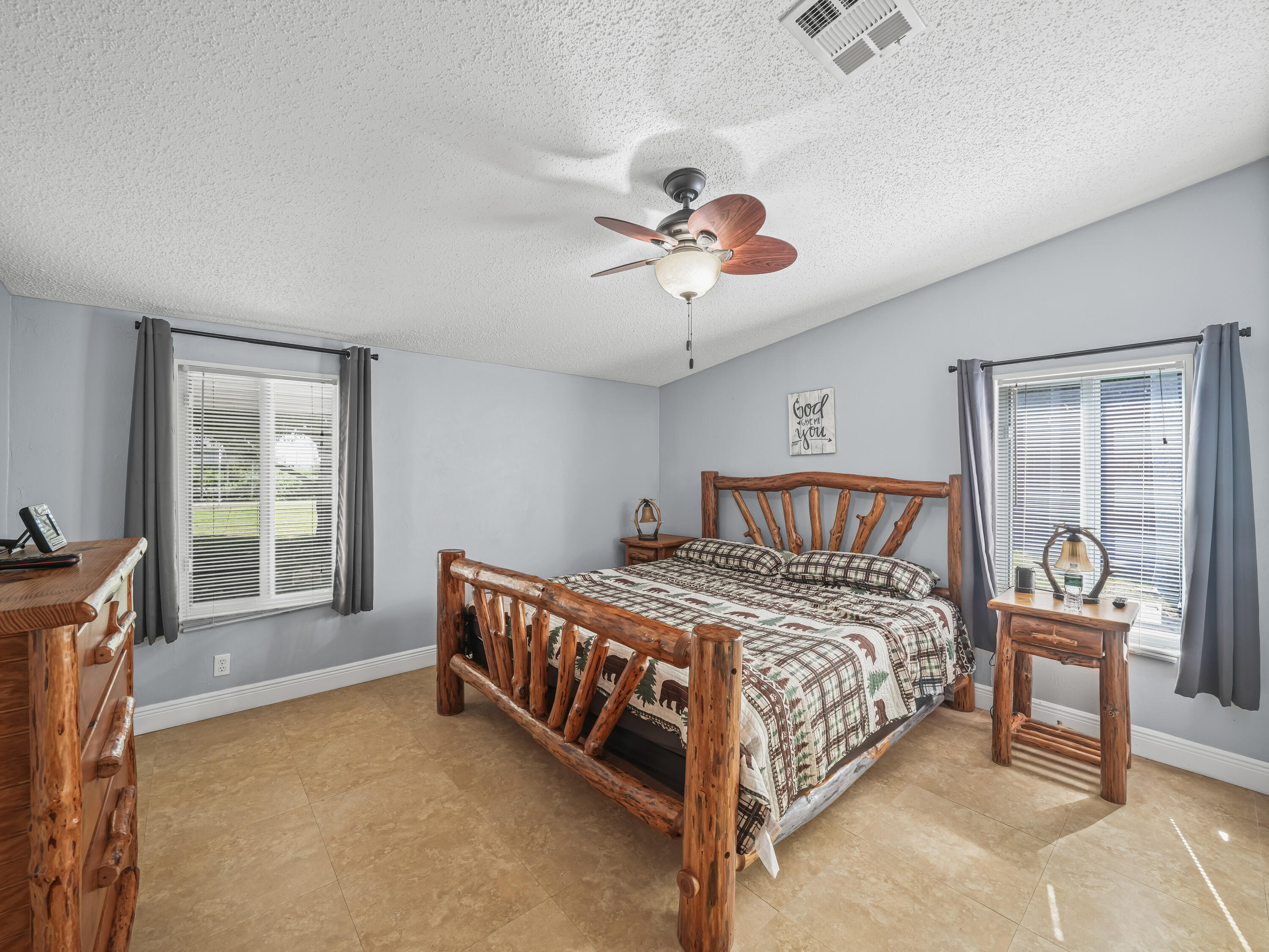 329 Kilpatrick Loop Clewiston, FL 33440 - Photo 21 of 56 a bedroom with a bed and a table in it