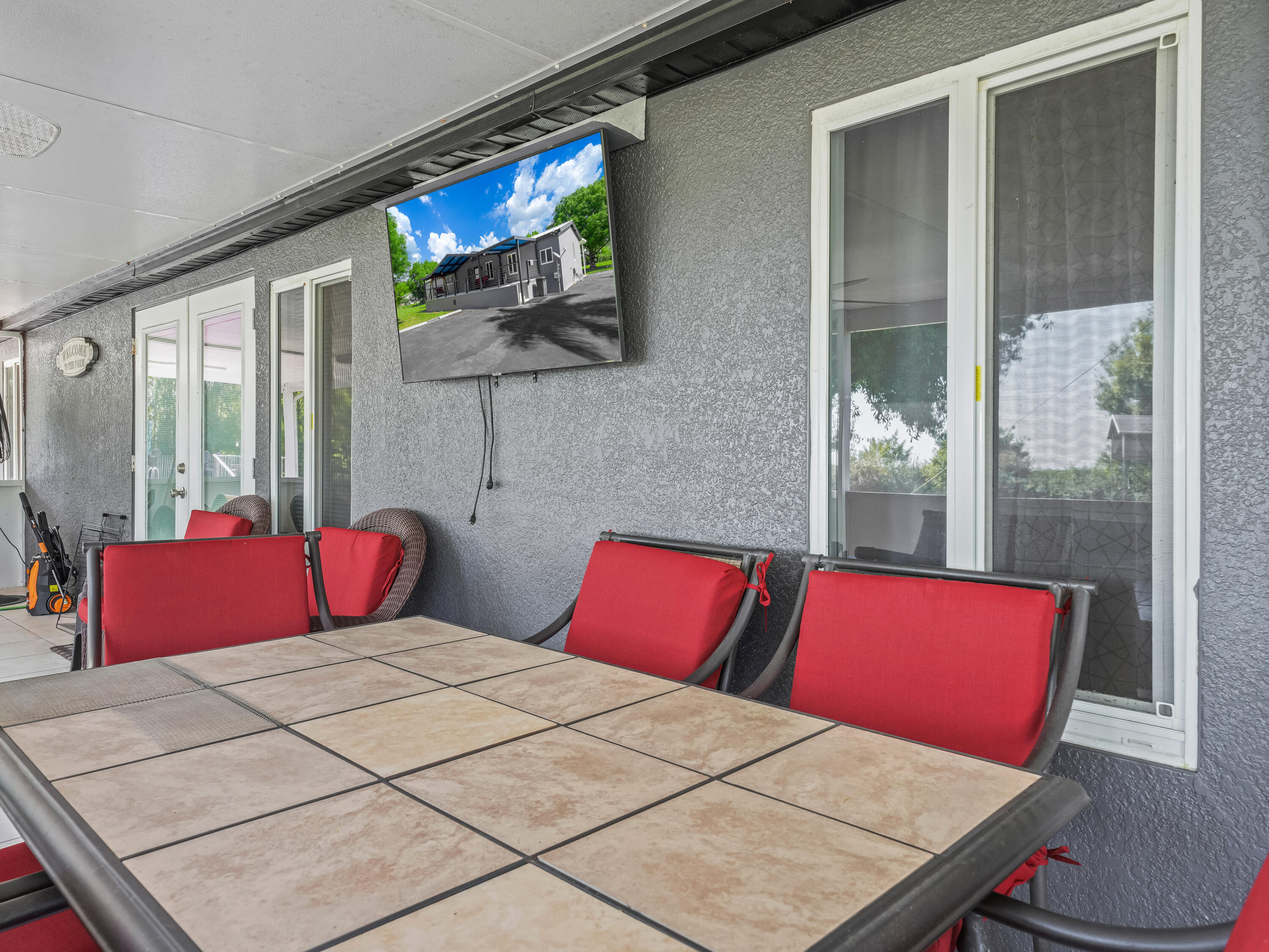 329 Kilpatrick Loop Clewiston, FL 33440 - Photo 28 of 56 a bedroom with a bed and a flat screen tv