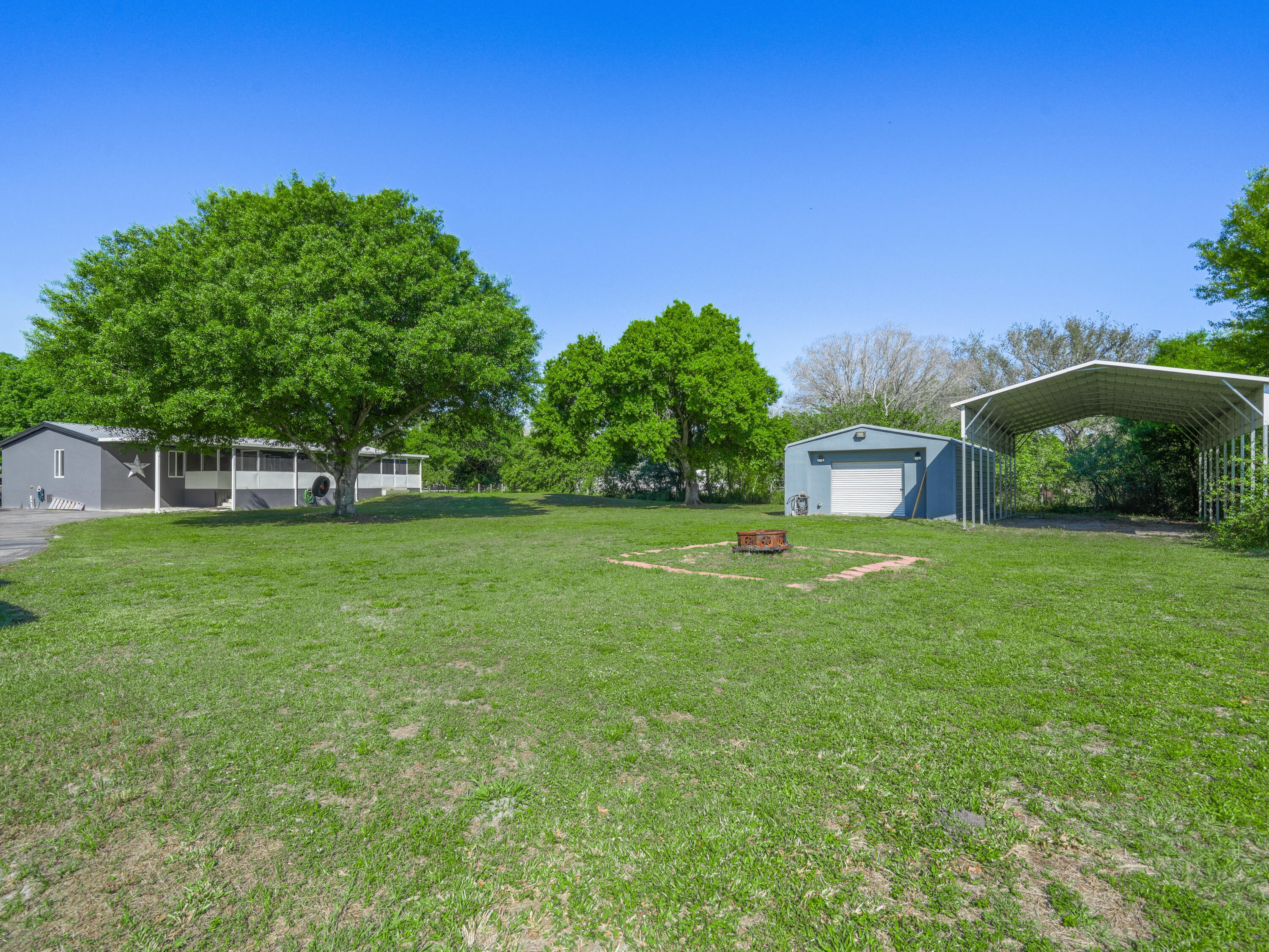 329 Kilpatrick Loop Clewiston, FL 33440 - Photo 31 of 56 a house view with a garden space