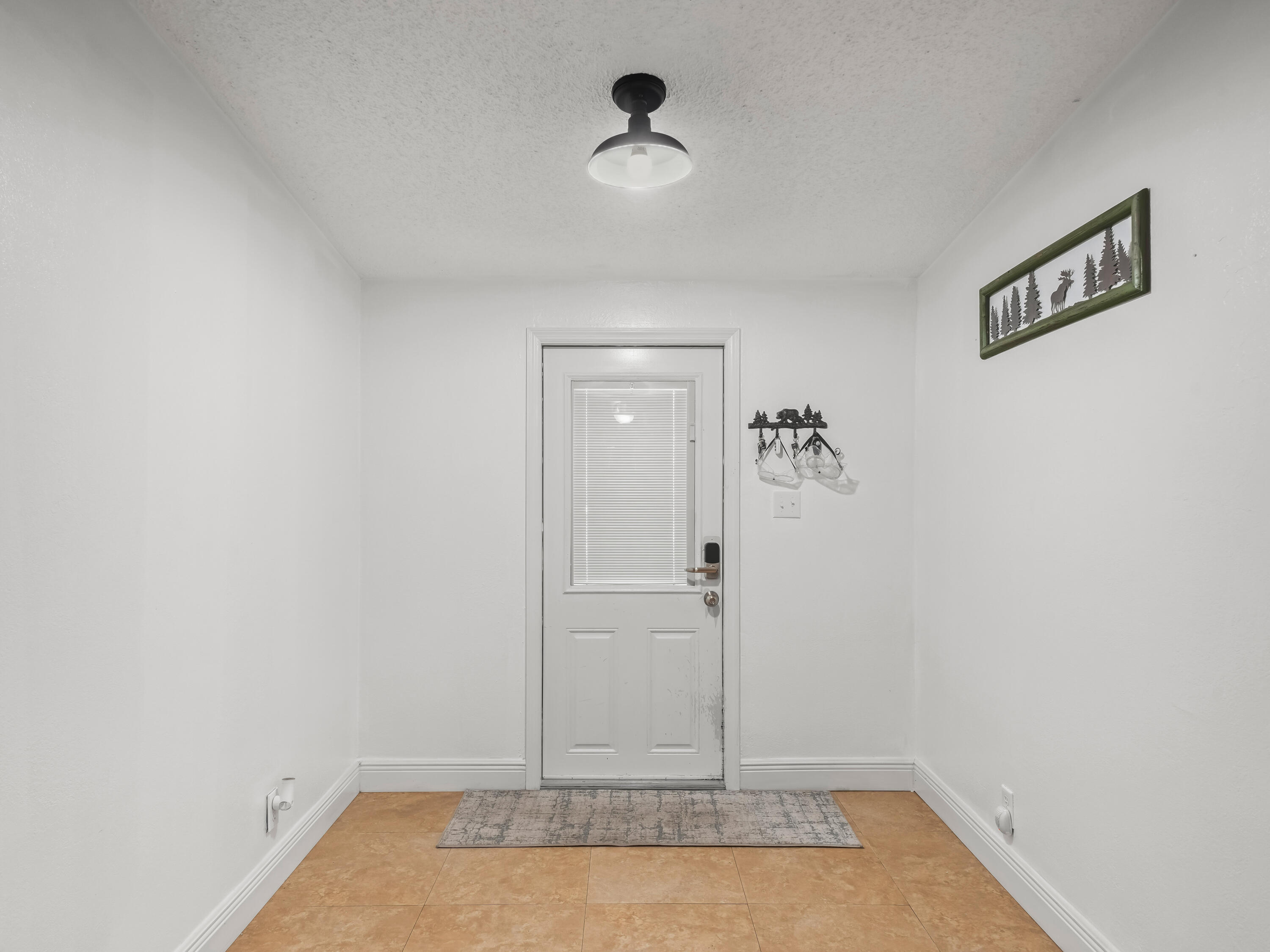 329 Kilpatrick Loop Clewiston, FL 33440 - Photo 4 of 56 a view of a room with rack on the wall