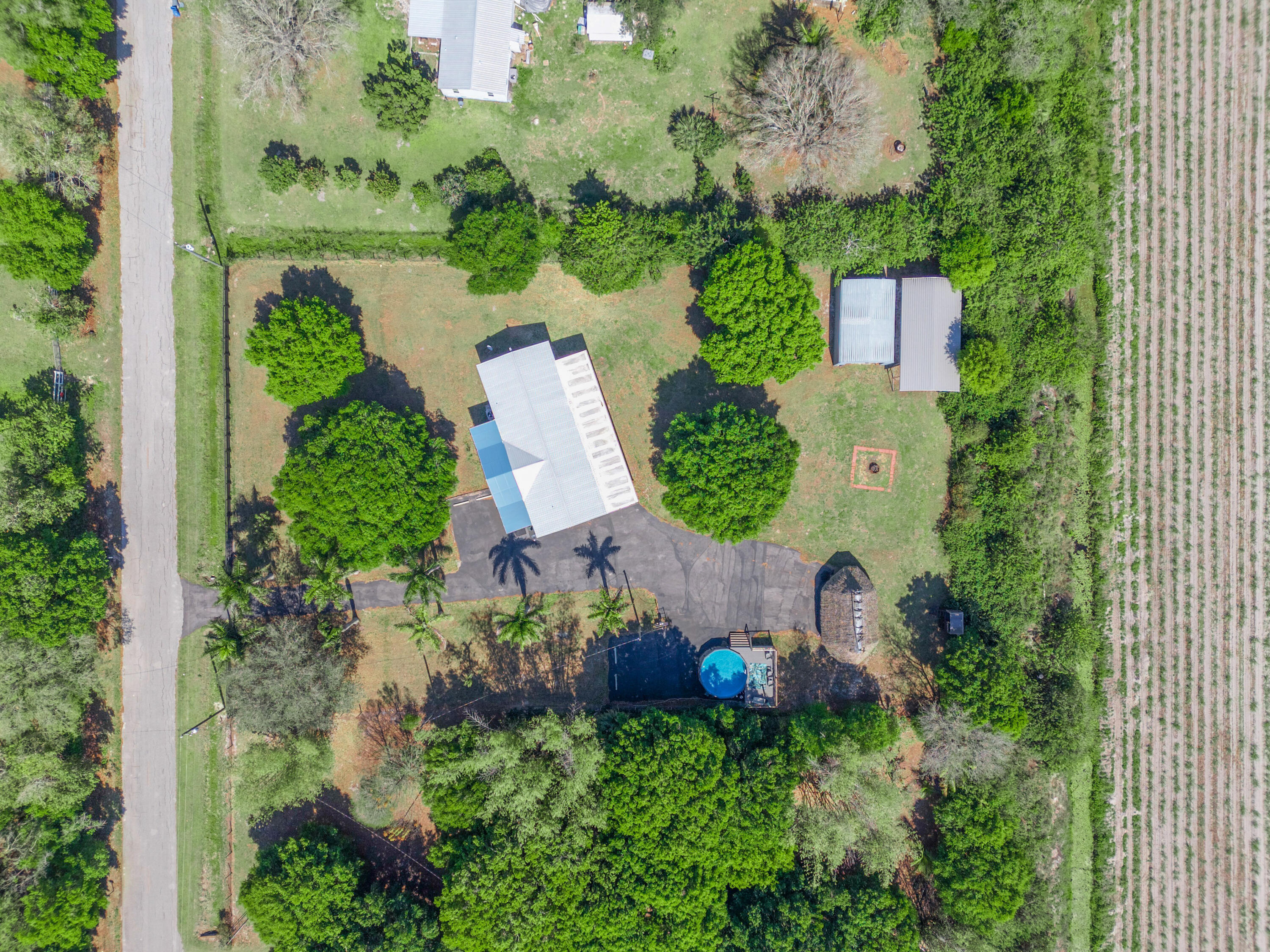 329 Kilpatrick Loop Clewiston, FL 33440 - Photo 43 of 56 an aerial view of a house with a yard and lake view