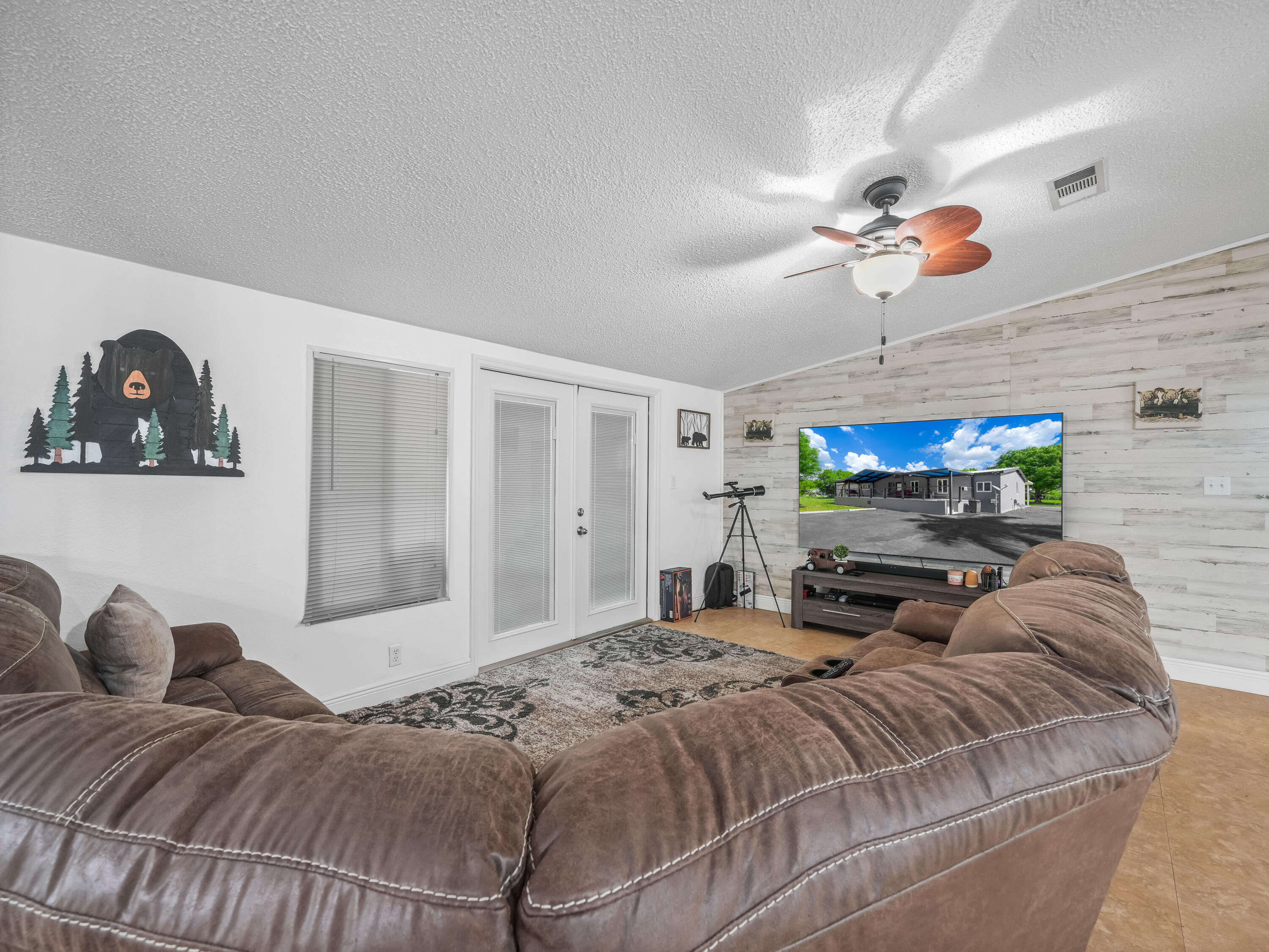 329 Kilpatrick Loop Clewiston, FL 33440 - Photo 6 of 56 a bedroom with a bed ceiling fan and a window