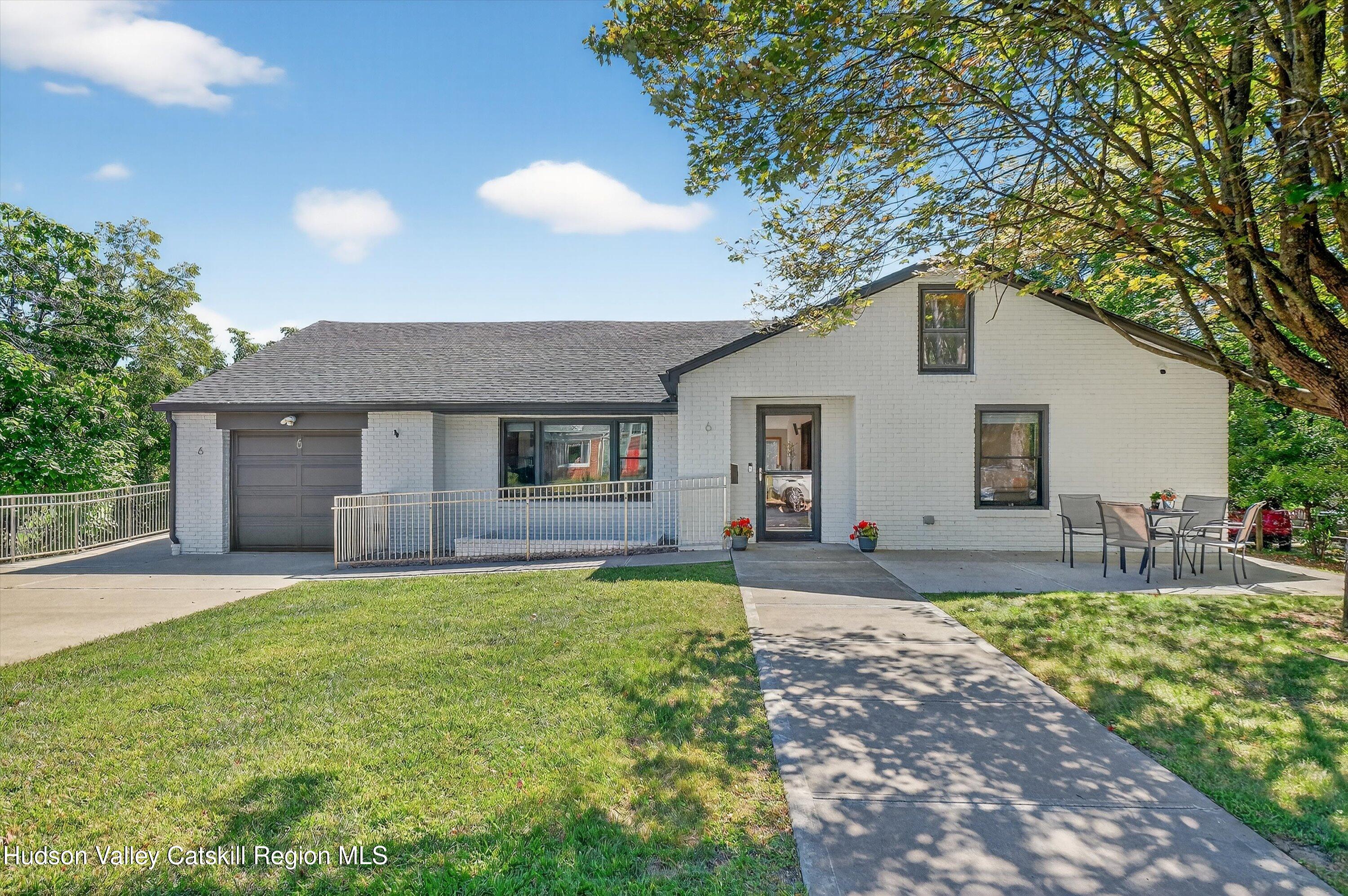 6 Hasbrouck Place New Paltz, NY 12561 - Photo 2 of 38 a front view of house with yard and trees around