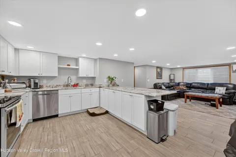 a kitchen with a sink and wooden cabinets