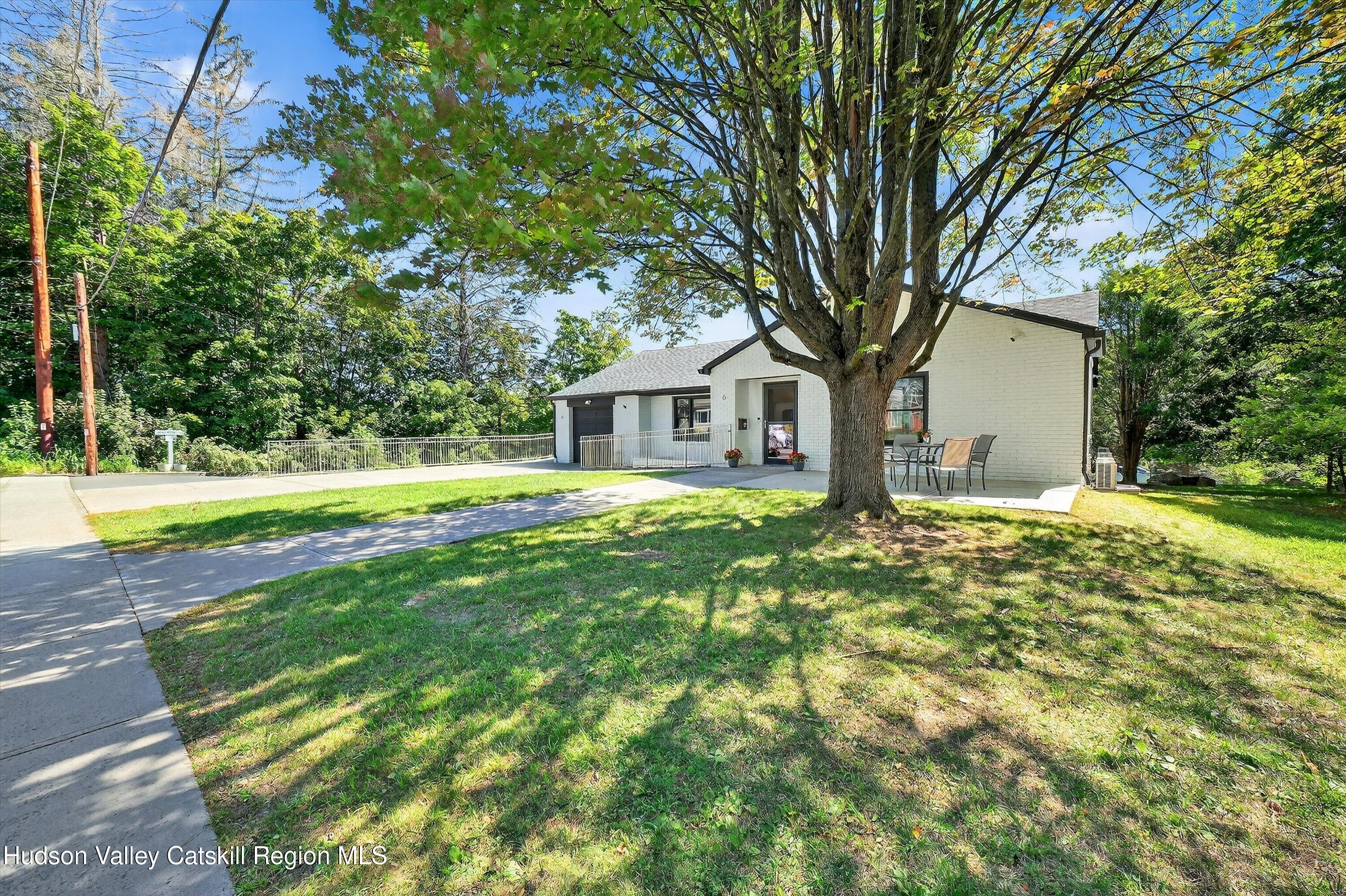 6 Hasbrouck Place New Paltz, NY 12561 - Photo 3 of 38 a front view of a house with a yard