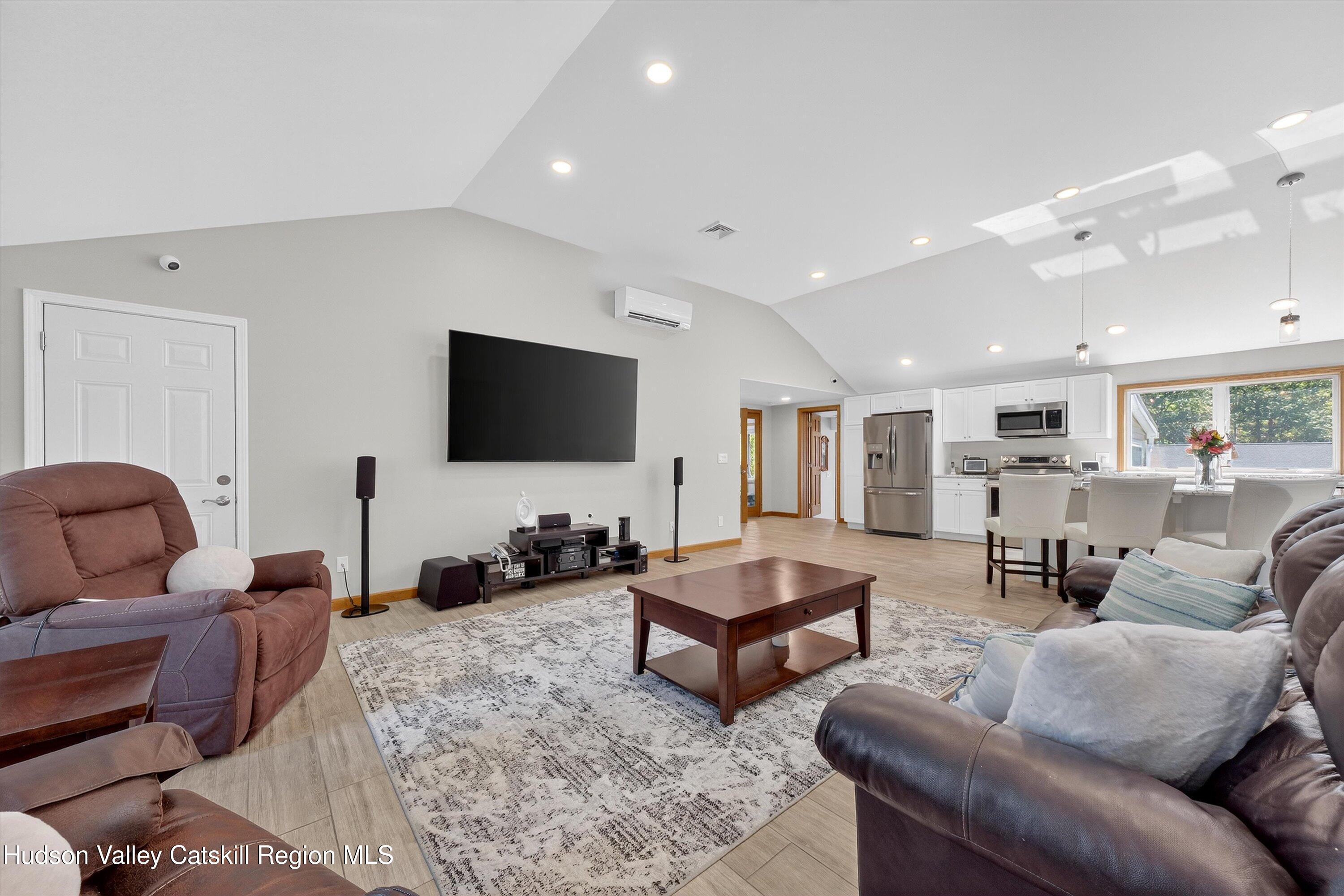 6 Hasbrouck Place New Paltz, NY 12561 - Photo 4 of 38 a living room with furniture and a flat screen tv