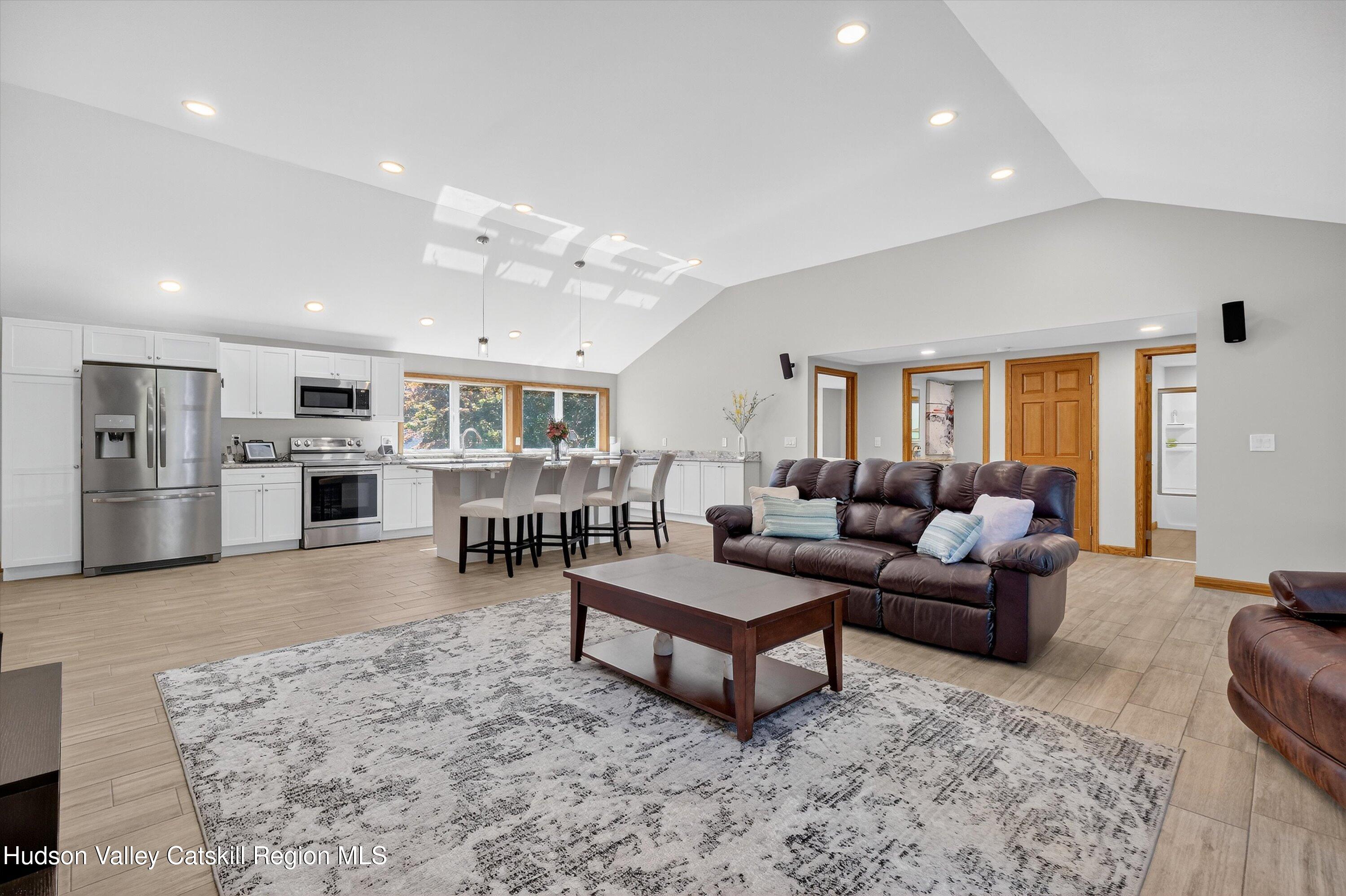 6 Hasbrouck Place New Paltz, NY 12561 - Photo 5 of 38 a living room with furniture and kitchen view