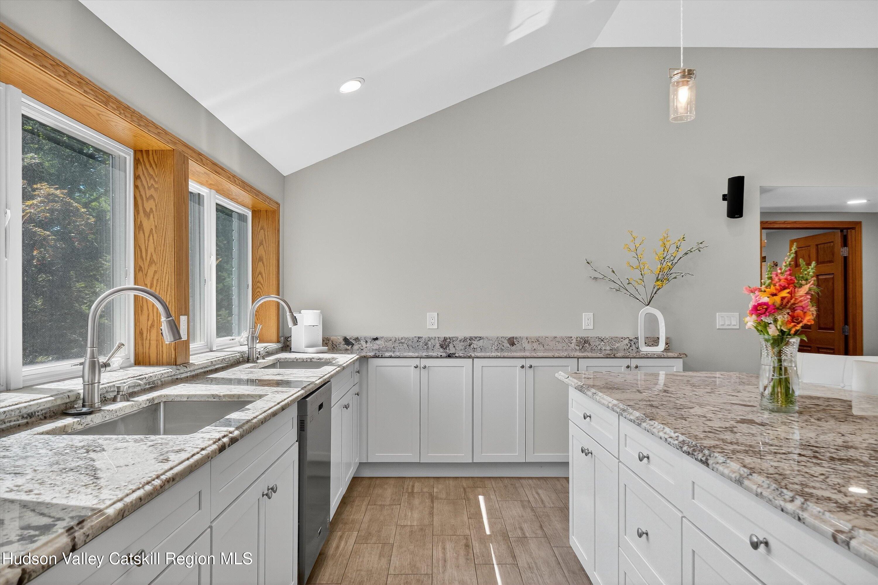 6 Hasbrouck Place New Paltz, NY 12561 - Photo 8 of 38 a kitchen with stainless steel appliances granite countertop a sink stove and cabinets
