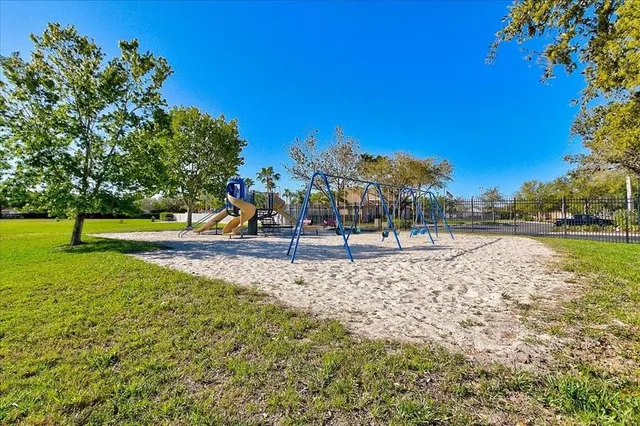 a view of a park with swings and slides