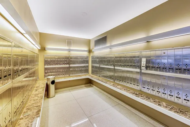 a view of a bathroom with a tub and large windows