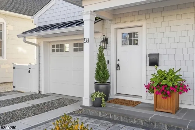 a potted plant sitting on the side of a brick building
