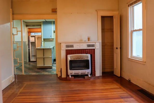 a view of a livingroom with furniture and a fireplace