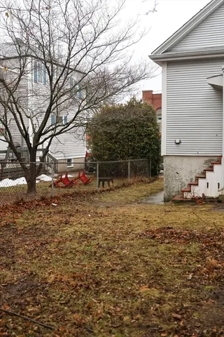 a backyard of a house with lots of green space