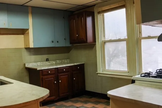 a room with a window and a sink