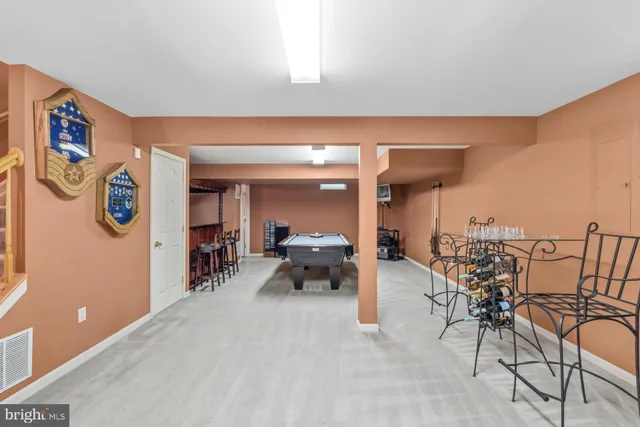 a living room with furniture and white walls